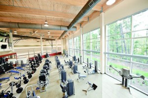 Stone Creek Athletic Club & Spa in Covington, La. has top-to-bottom glass and rich wood ceilings.
